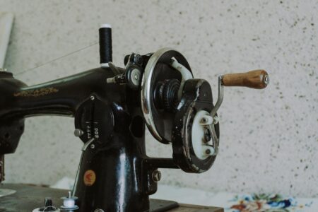 Close-up view of a modern sewing machine with fabric being sewn