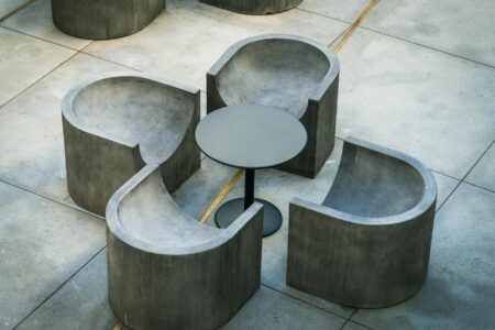 Modern furniture showroom with sleek tables and seating displaying contemporary design trends