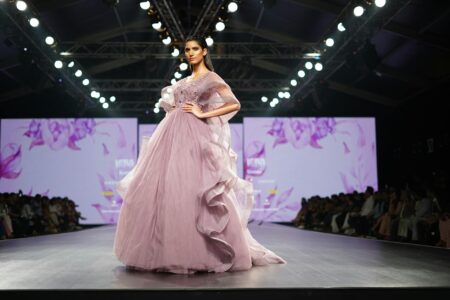 Models walking on fashion runway during luxury fashion show