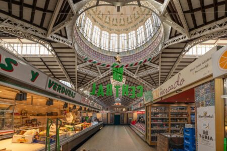 Modern food hall with high ceilings and diverse vendor stalls, showing open layout perfect for intimate concerts