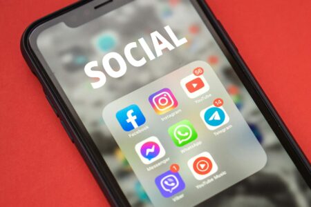 Person using smartphone to create social media content
