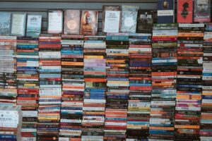Bookstore shelves lined with colorful manga volumes and graphic novels