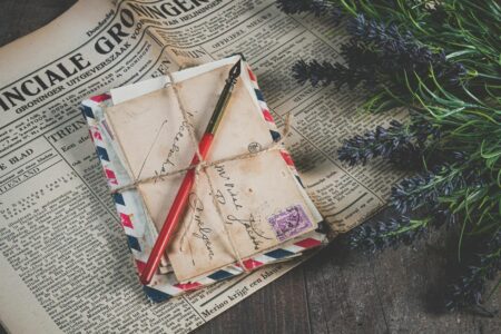 Close-up of handwritten letter with pen on paper showing personal correspondence