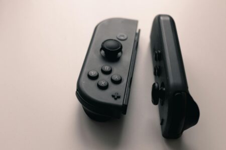 Modern gaming controller on dark surface