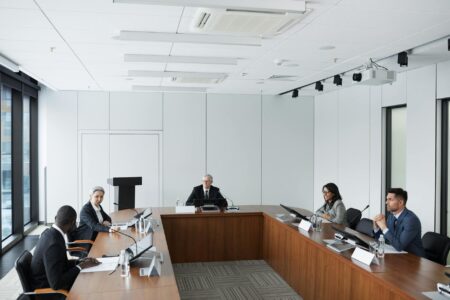 Professional using mobile device for business presentation demonstrating productivity benefits
