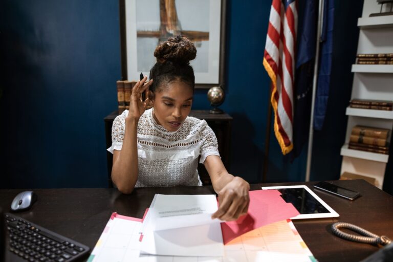 Stack of federal government policy documents on a desk