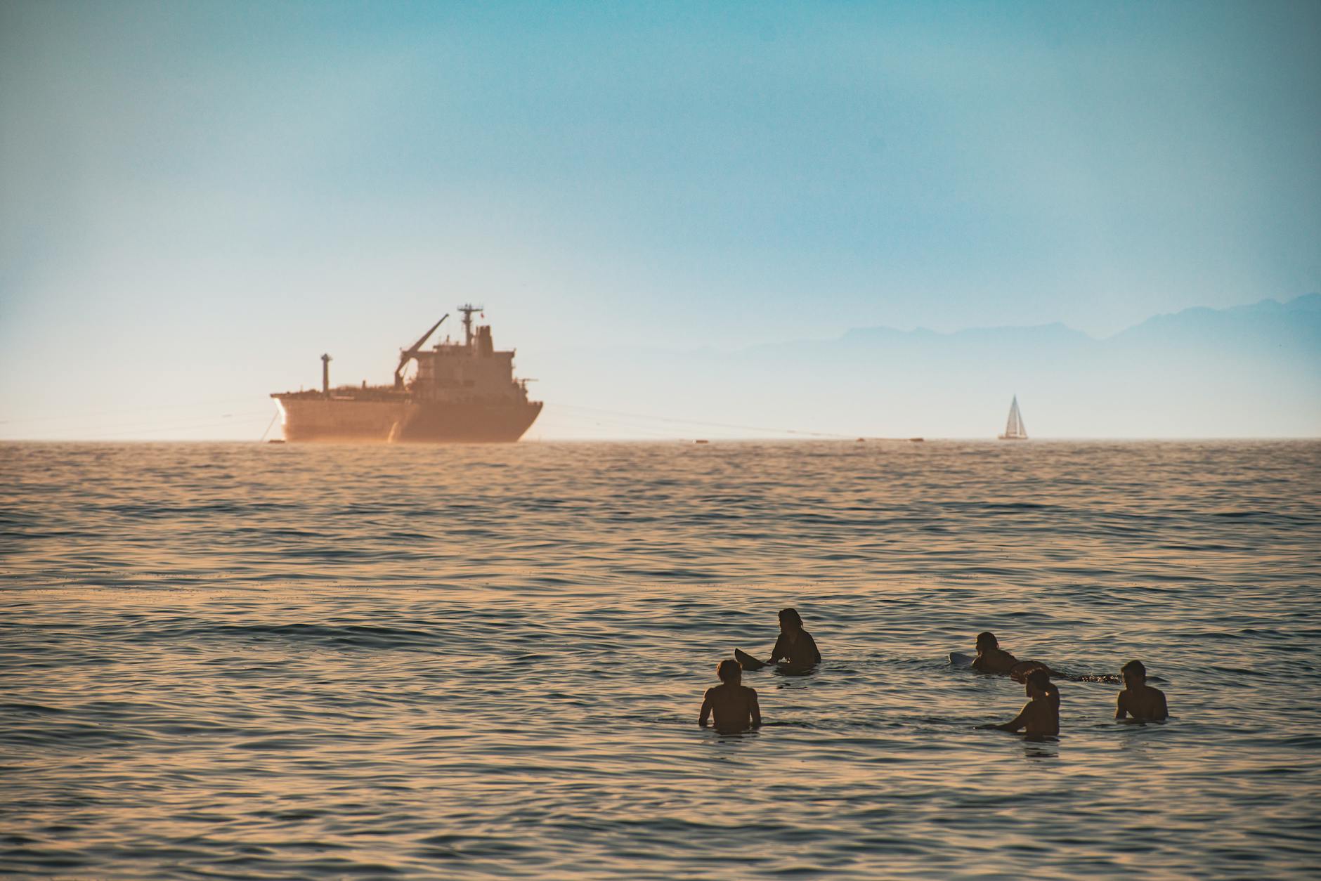 Large oil tanker crossing open ocean waters at dusk