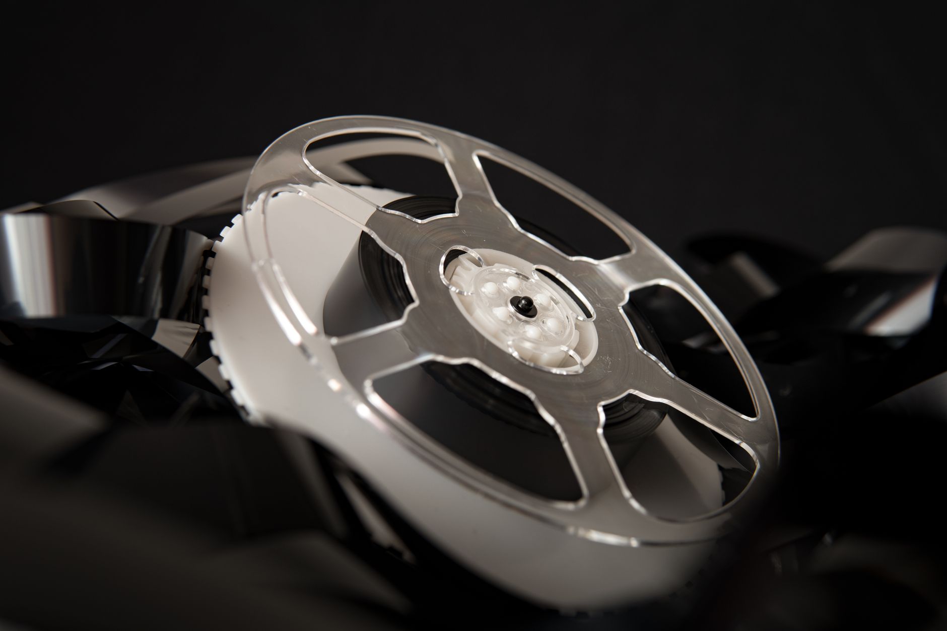 Close-up of an old film reel with exposed celluloid