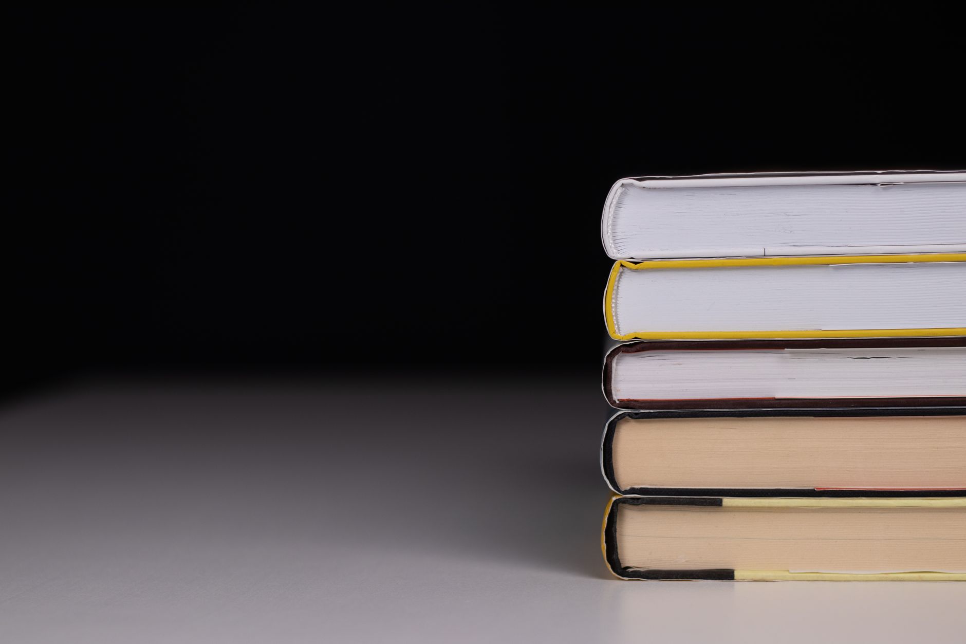 A dark, atmospheric hardcover book on a shadowed surface suggesting horror fiction
