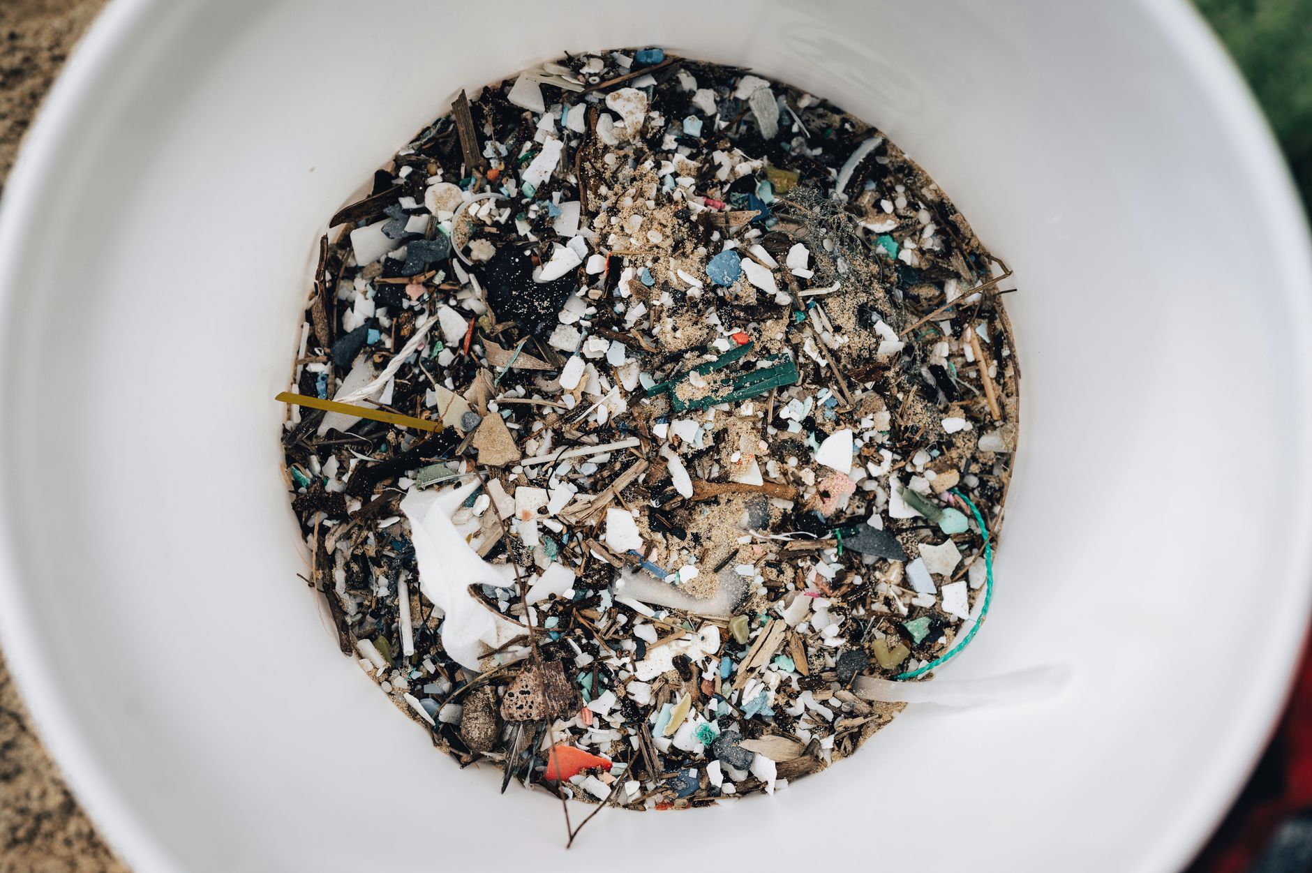 Scattered brightly colored plastic fragments on a natural surface