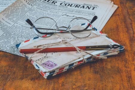 Why a Journal Retracted Two 1940s Papers by Max Planck Aged academic journal pages spread open on a wooden desk