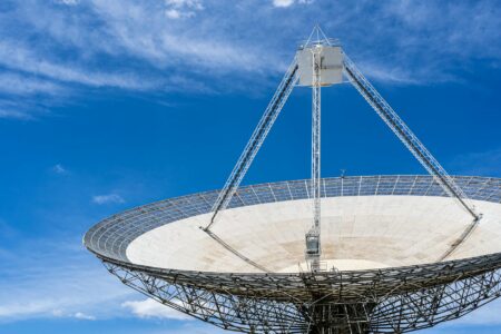FCC Lifts Deadline for Amazon’s Low-Earth Orbit Satellite Broadband Constellation Low Earth orbit satellite passing over Earth against a dark sky