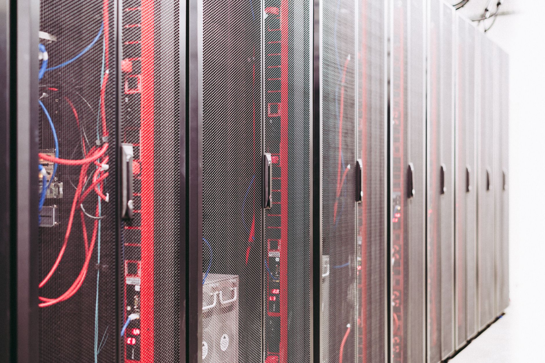 Rows of servers inside a large-scale data center facility