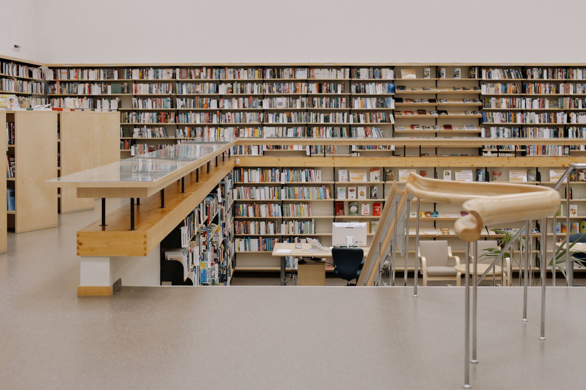 Empty shelves in a dimly lit academic archive room