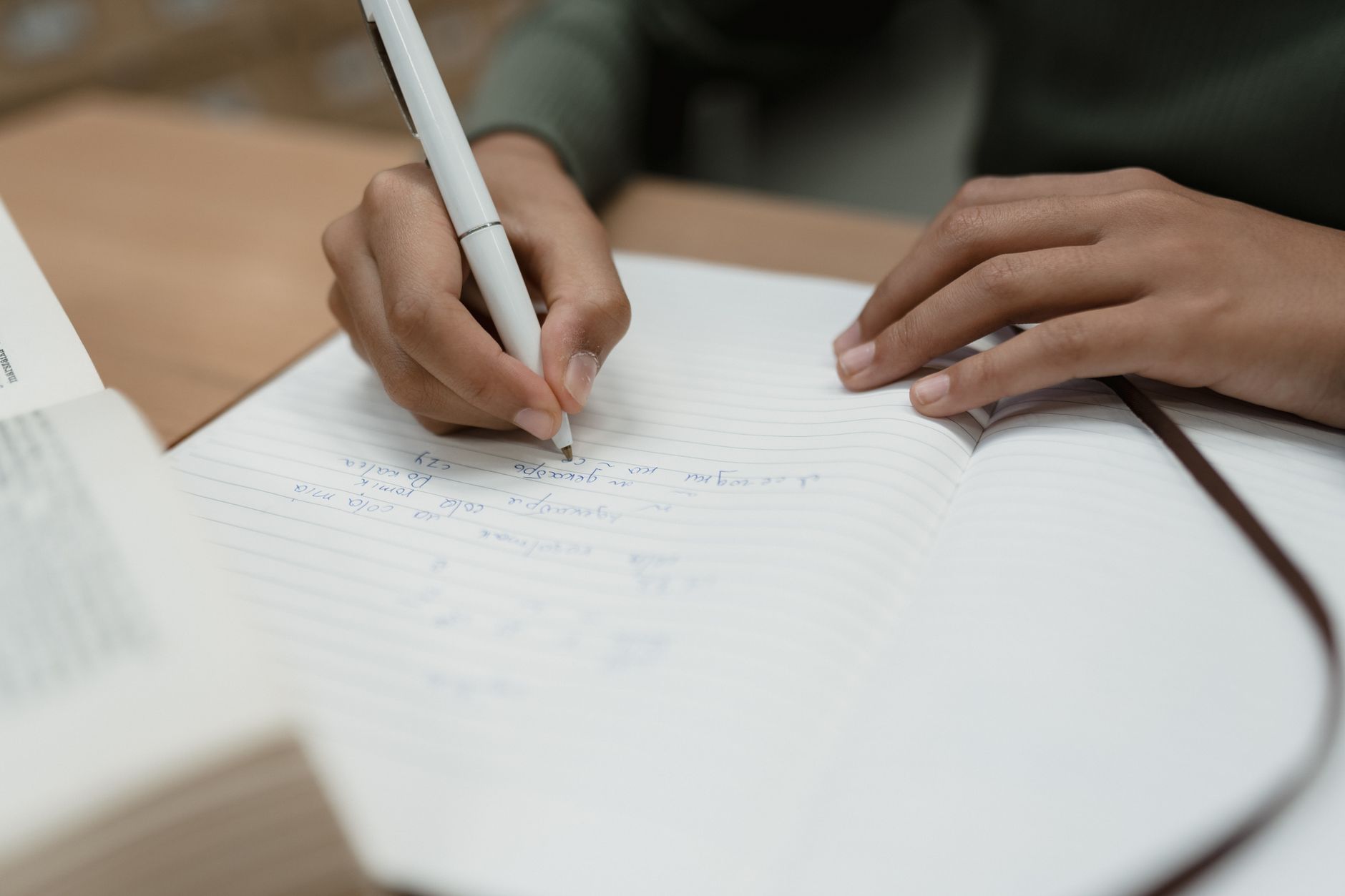 Printed academic journal articles and research papers spread on a table