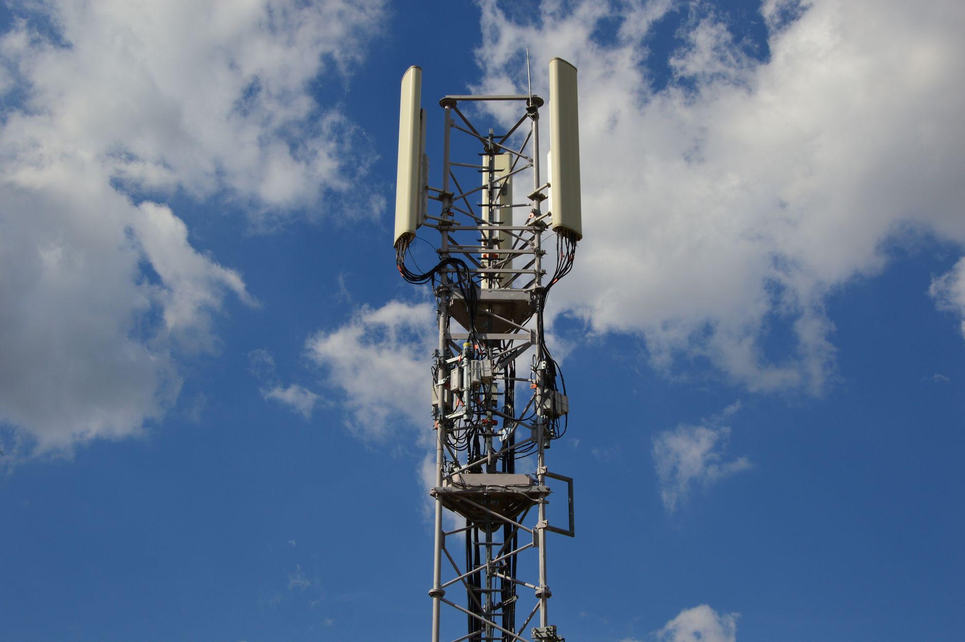 Satellite dish mounted outside a rural home for broadband internet access