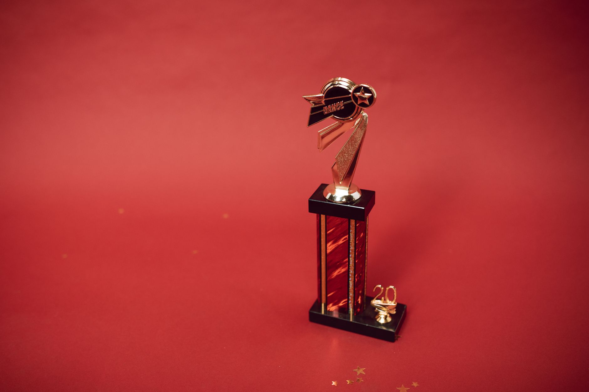 A literary award trophy on a shelf symbolizing fiction competition recognition