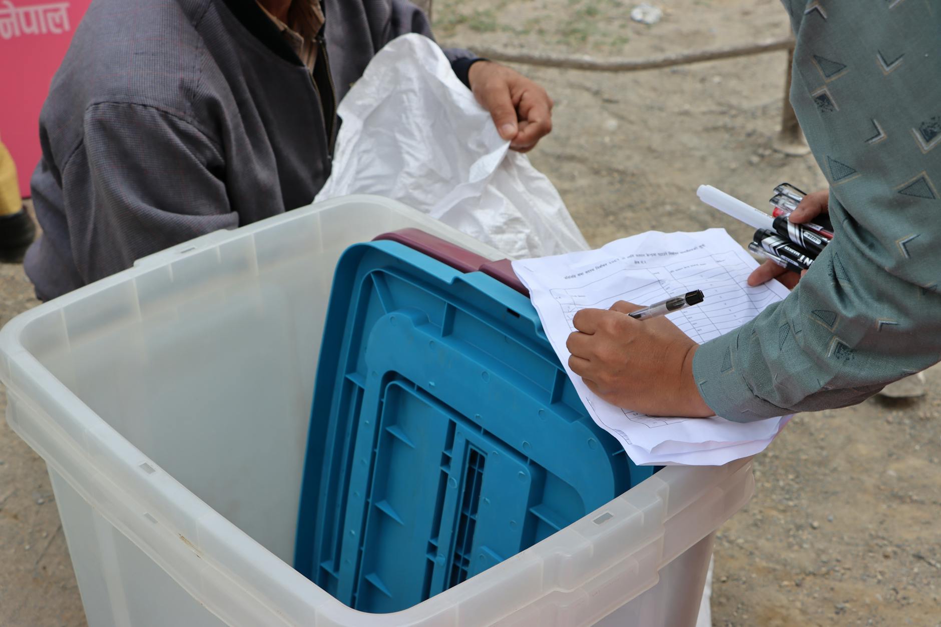 Election workers counting ballots at a table during a primary election
