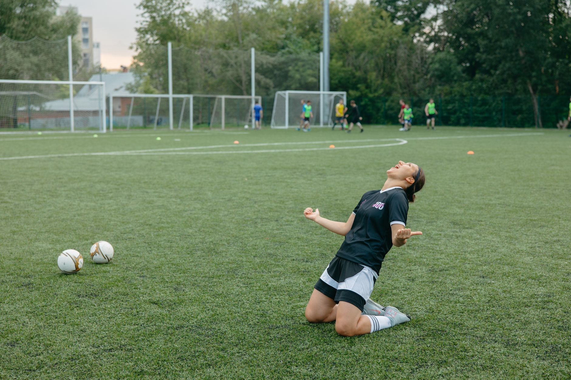 A footballer celebrating after scoring a decisive goal in a major match