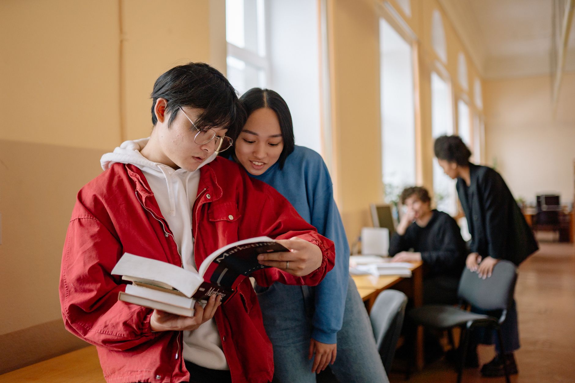A small group gathered around a table for a book discussion
