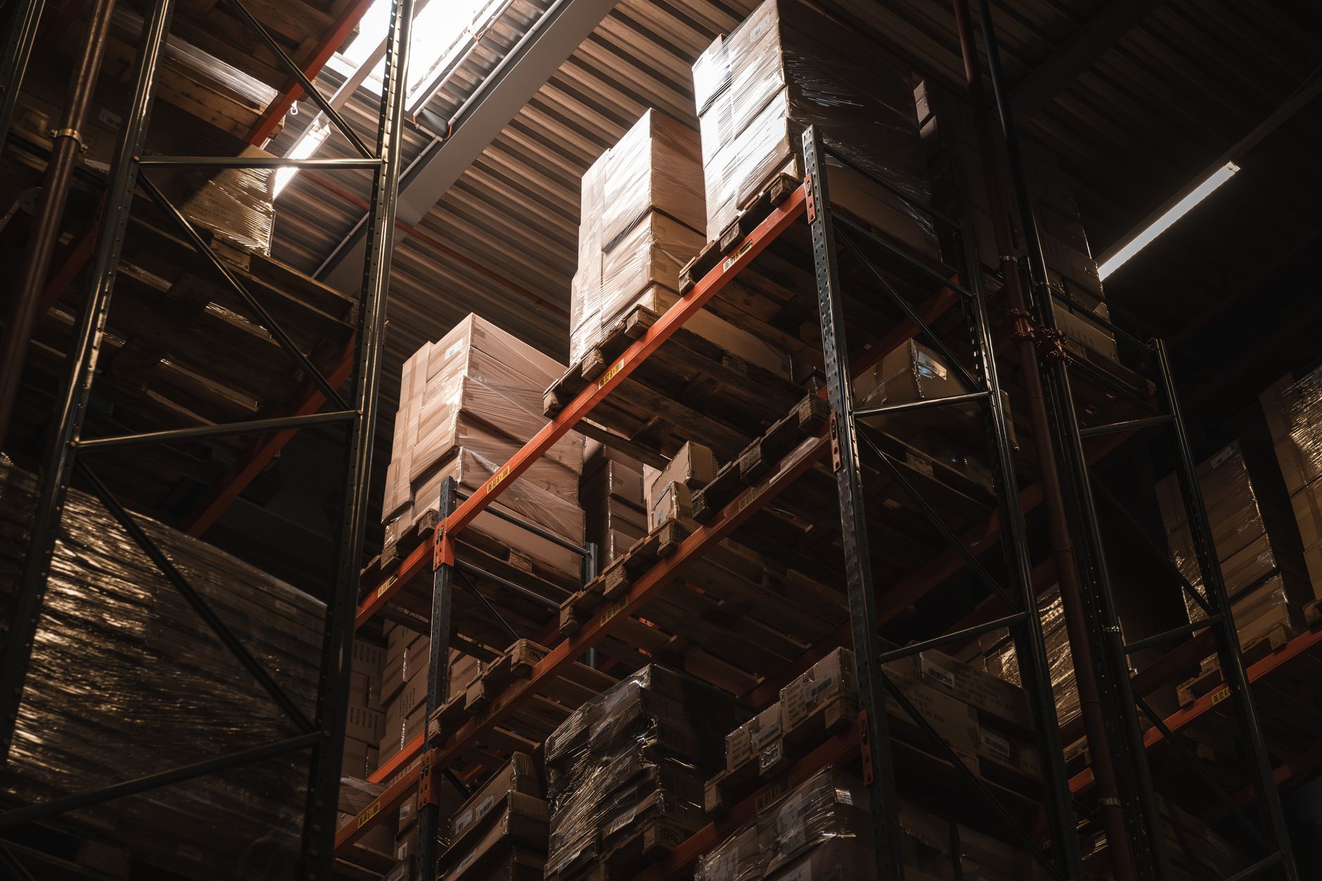 Interior of a modern logistics warehouse with stacked packages and freight
