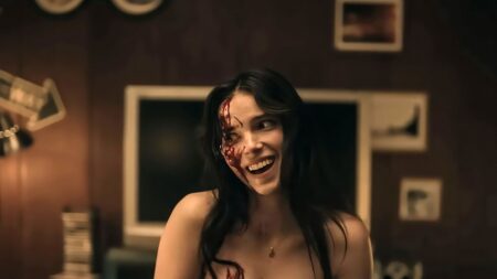Dark atmospheric film set with dramatic lighting suggesting a horror production