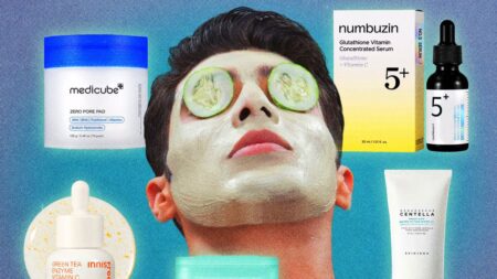 Arranged Korean skincare products including toner, essence, and moisturizer on a clean surface