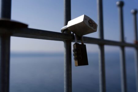 A laptop with a security padlock icon on the screen representing malware threats