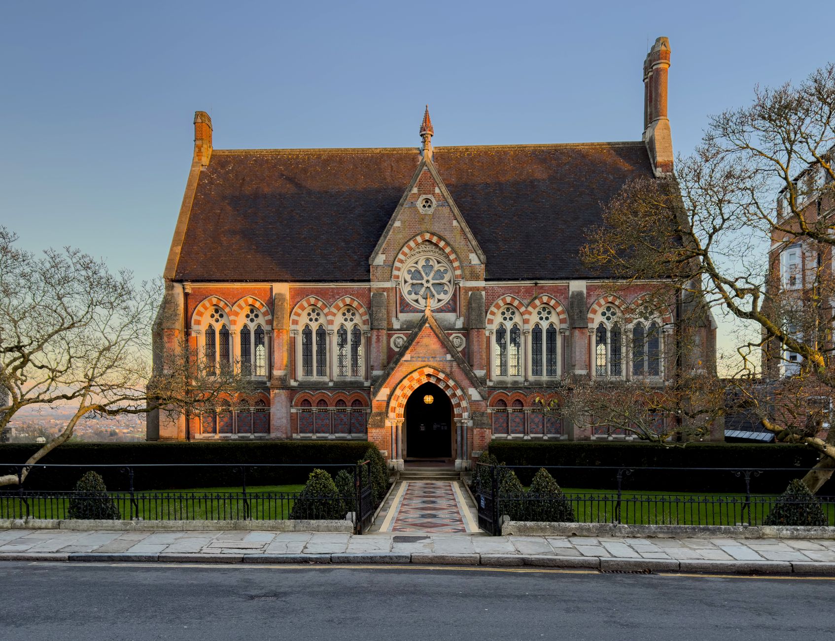 Exterior of a grand private school building with manicured grounds