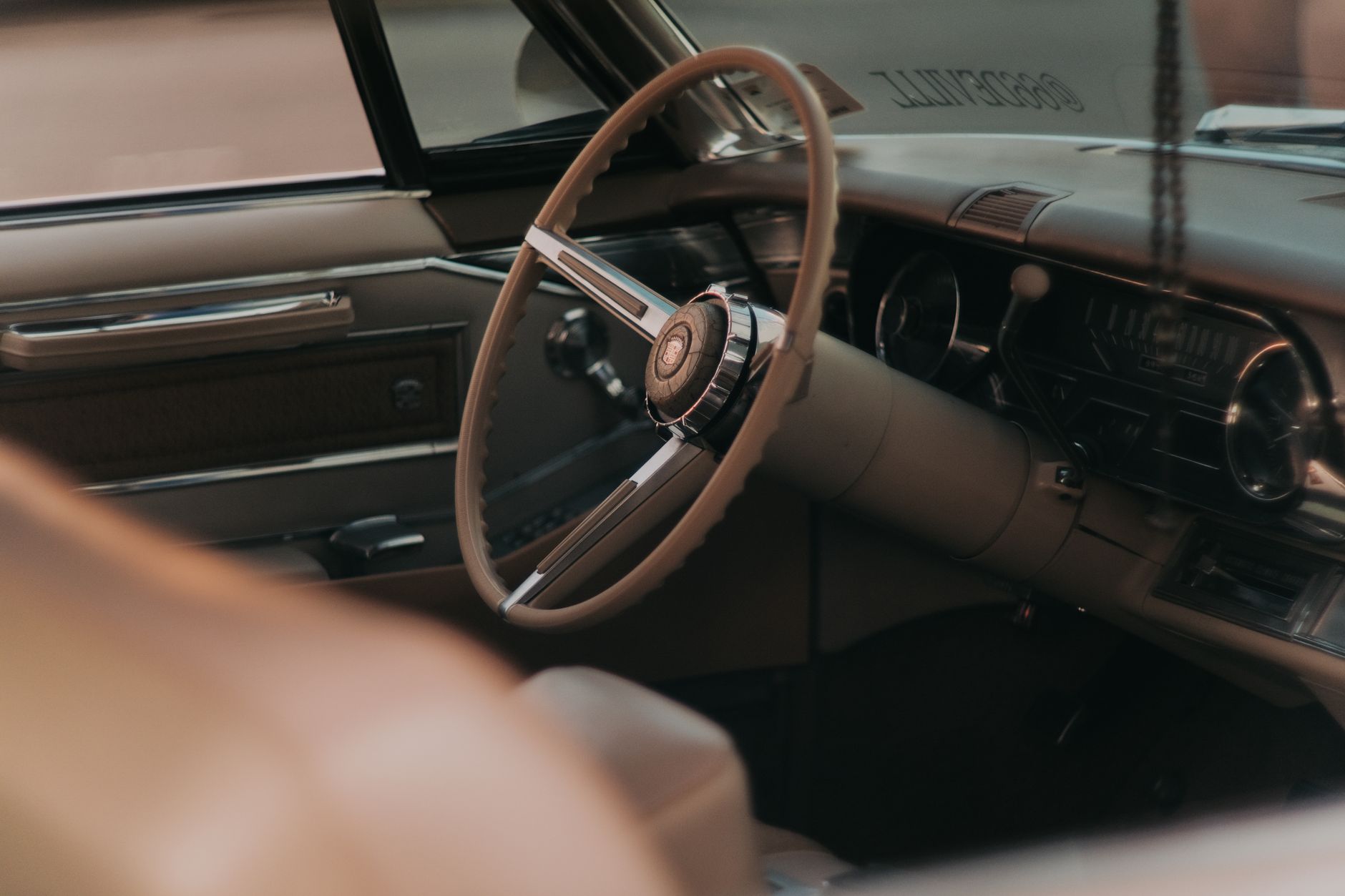 Premium automotive interior with ambient lighting and three-row seating layout