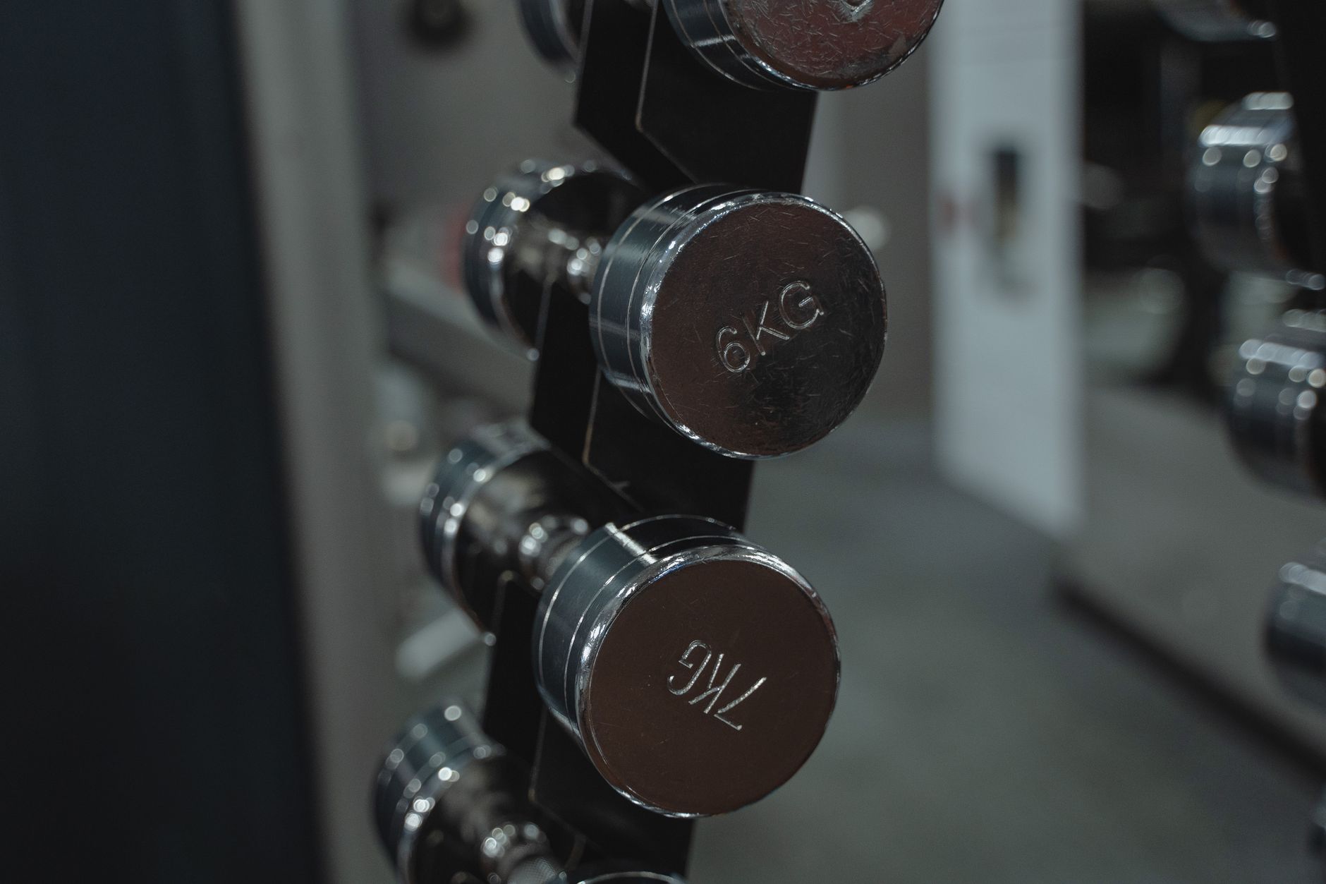 Person lifting weights in a focused gym training session