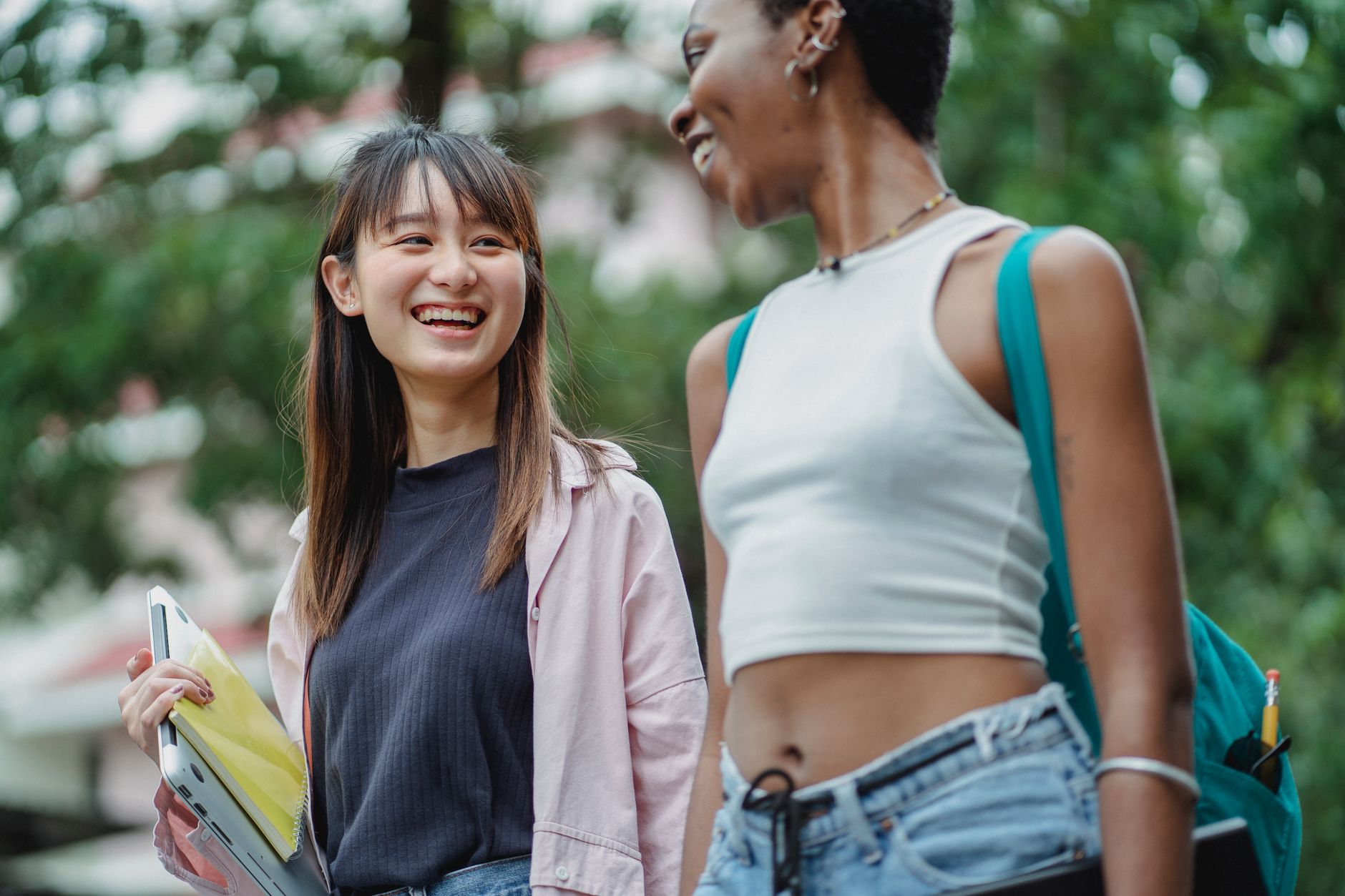Students walking across a college campus between classes