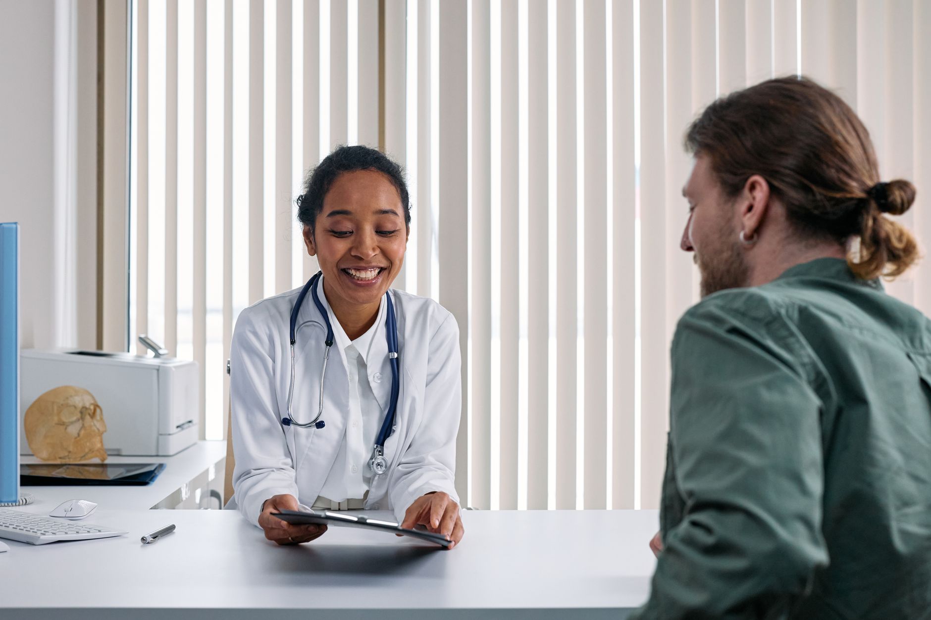 Doctor reviewing test results with a patient during a checkup