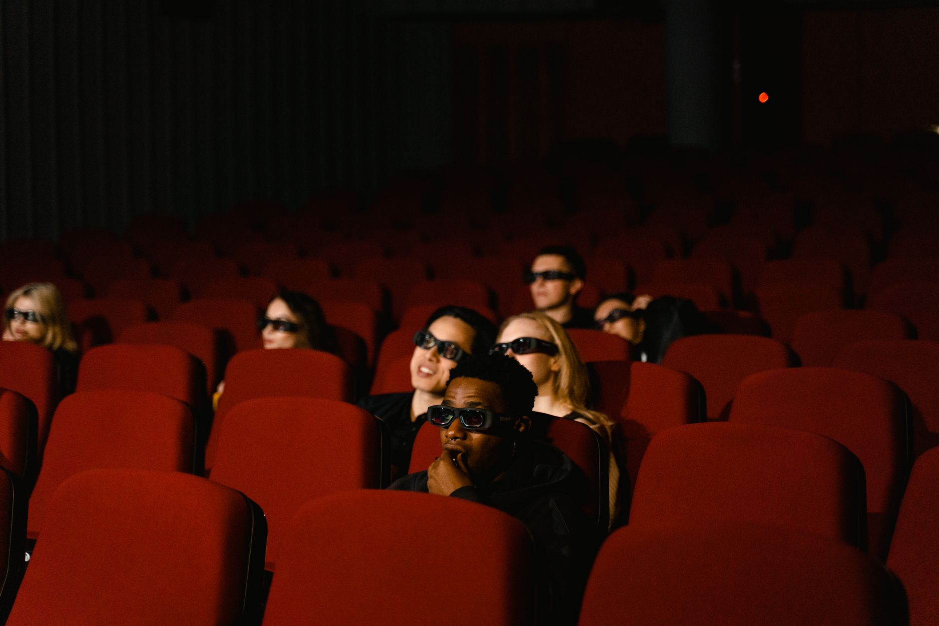 Crowd gathered at a major film premiere event under bright lights