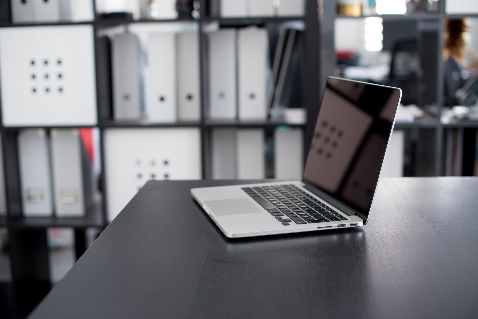 MacBook laptop open on a desk representing macOS security vulnerability