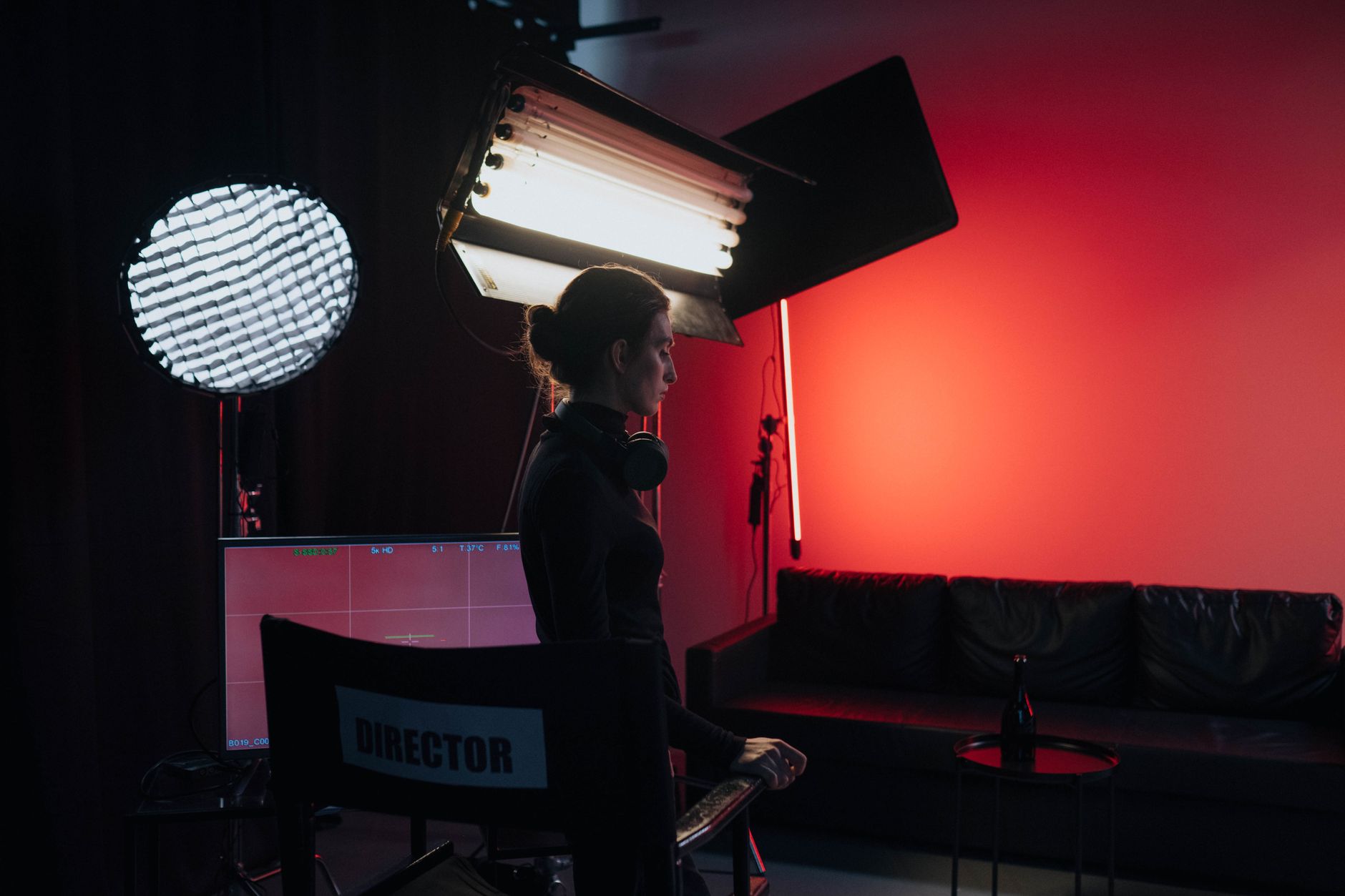 Camera crew on a dimly lit television or film production set