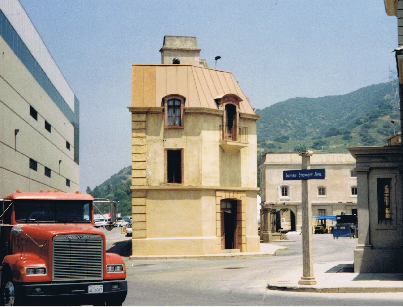 Exterior of a Hollywood studio lot with production buildings in background