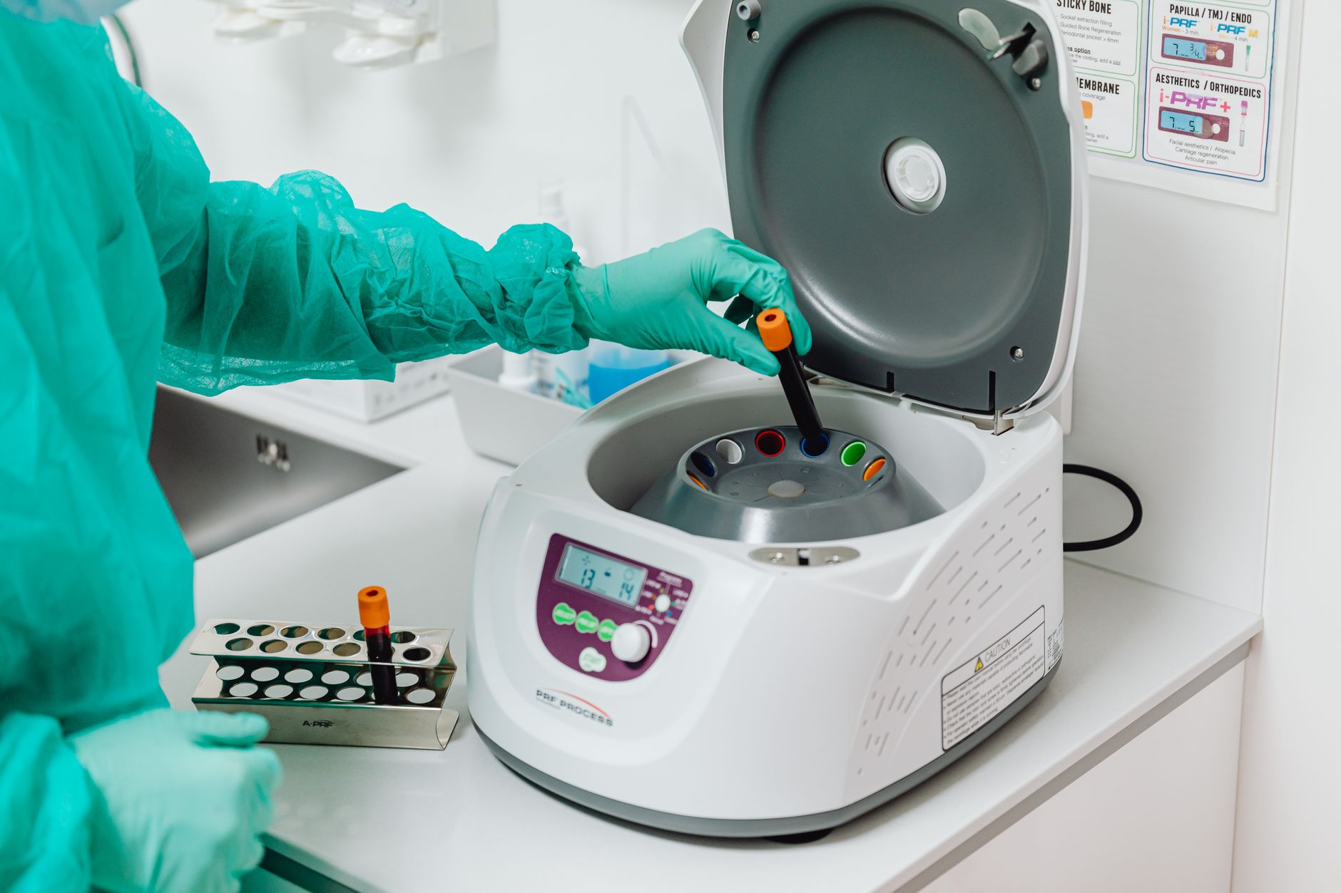 Researcher working with high-speed camera equipment in a science lab