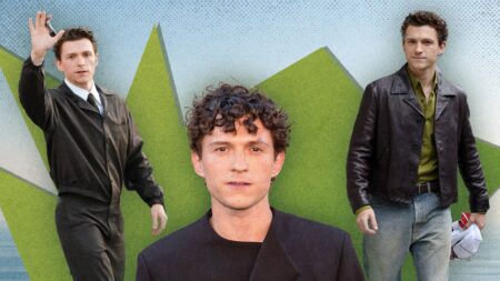 Male actor posing on a red carpet in sharp tailored suit