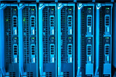 Rows of enterprise servers in a datacenter with blinking indicator lights