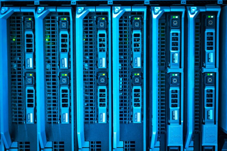 Rows of enterprise servers in a datacenter with blinking indicator lights