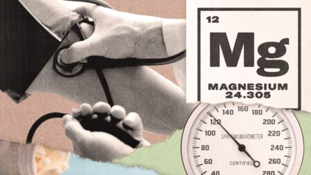 Close-up of magnesium supplement capsules on a white surface