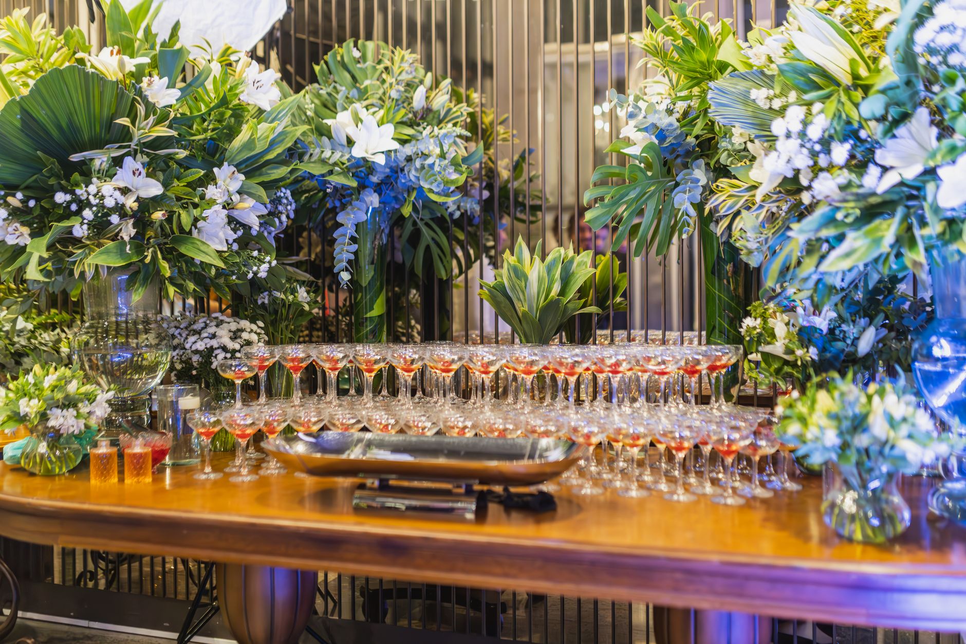 Guests mingling at an upscale evening event with ambient lighting