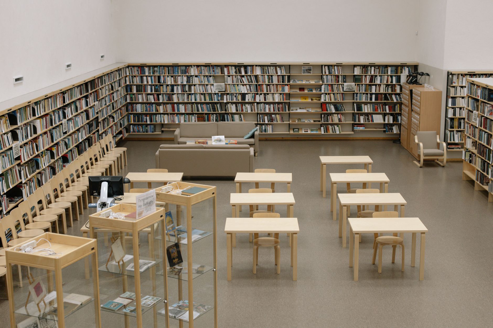 Rows of books on library archive shelves, representing forgotten and rediscovered literature